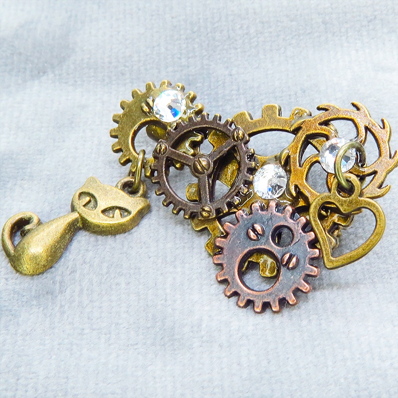 アンティークゴールド 猫と歯車を組合せたスチームパンク風のコンパクトなブローチ バッジ ラインストーン