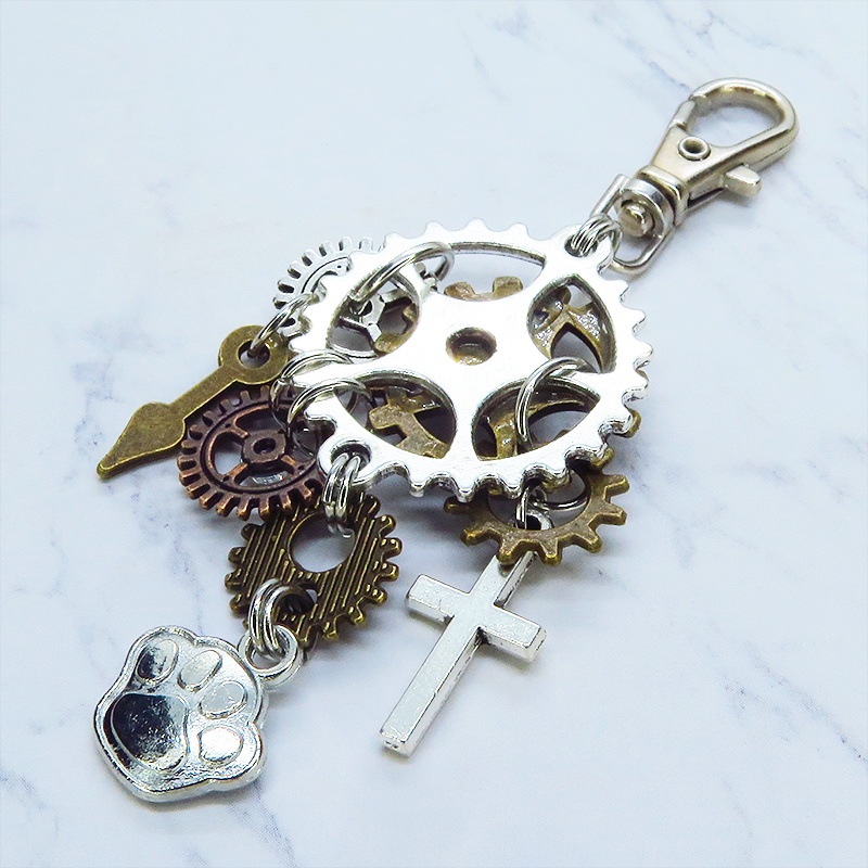 アンティークシルバー 歯車と肉球を組合せたスチームパンク風キーホルダー バッグチャーム ラインストーン