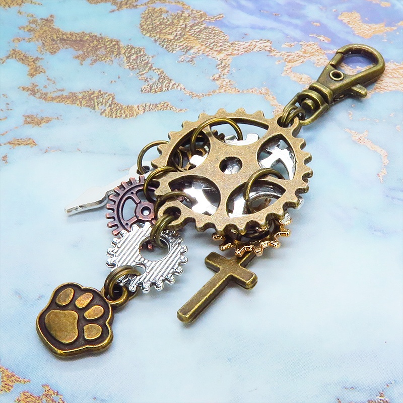 アンティークゴールド 歯車と肉球を組合せたスチームパンク風キーホルダー バッグチャーム ラインストーン 犬 猫