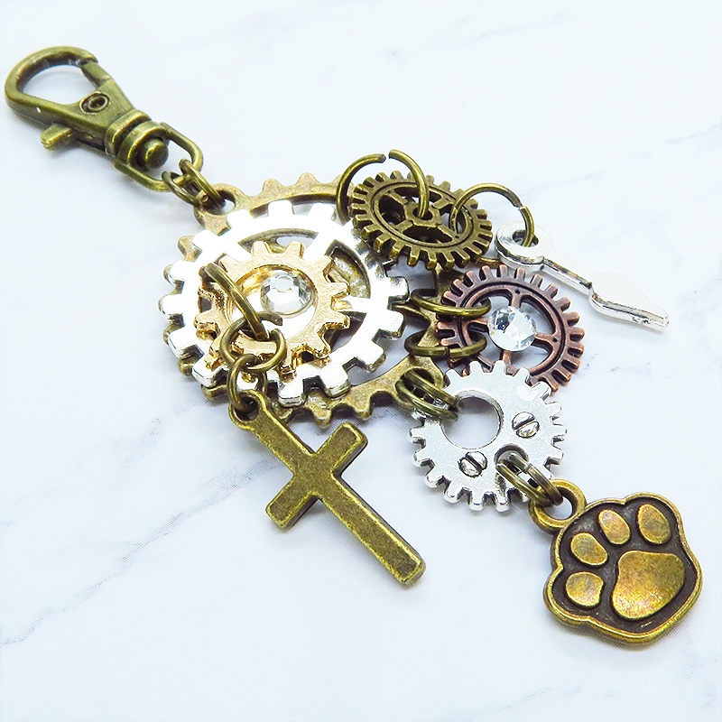 アンティークゴールド 歯車と肉球を組合せたスチームパンク風キーホルダー バッグチャーム ラインストーン 犬 猫
