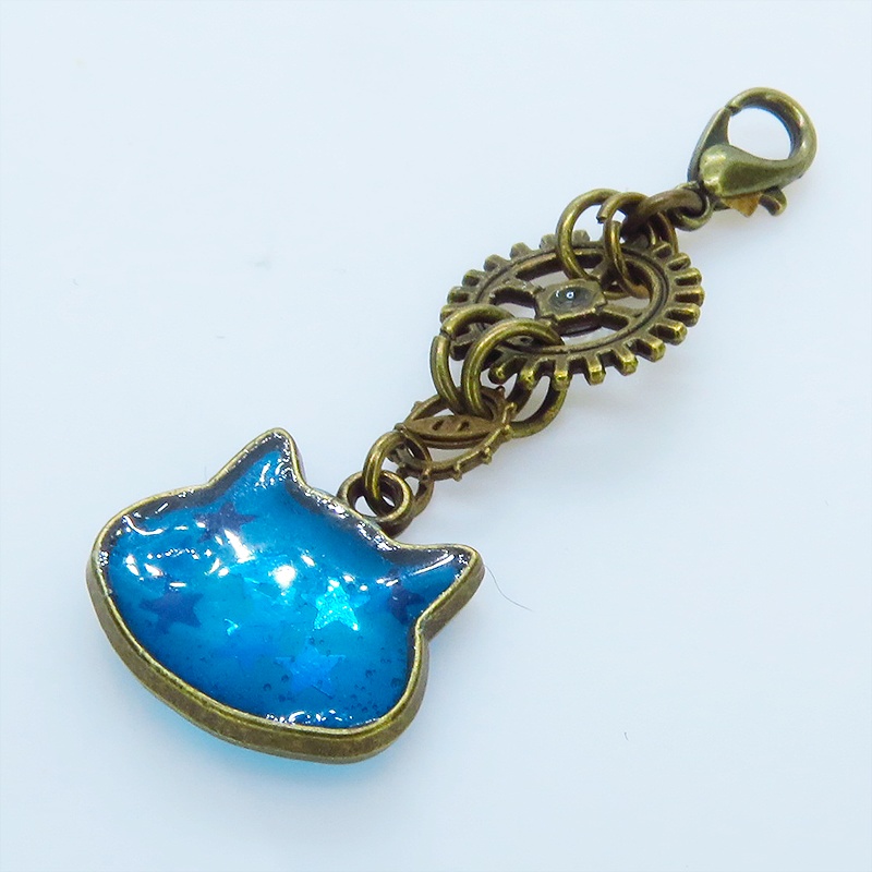 マスク・スマホチャーム ブルーキャットスター 青い猫フェイスに星を散りばめたチャーム アンティークゴールド 歯車 金具変更可