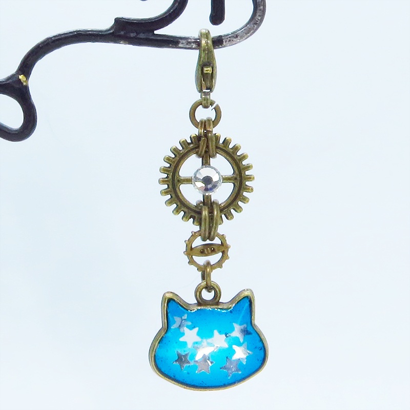 マスク・スマホチャーム ブルーキャットスター 青い猫フェイスに星を散りばめたチャーム アンティークゴールド 歯車 金具変更可