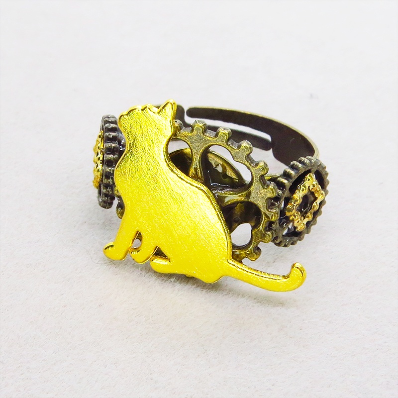 アンティークゴールドリング 見上げる猫シルエットモチーフに歯車を組合せたスチームパンク風リング 指輪 フリーサイズ