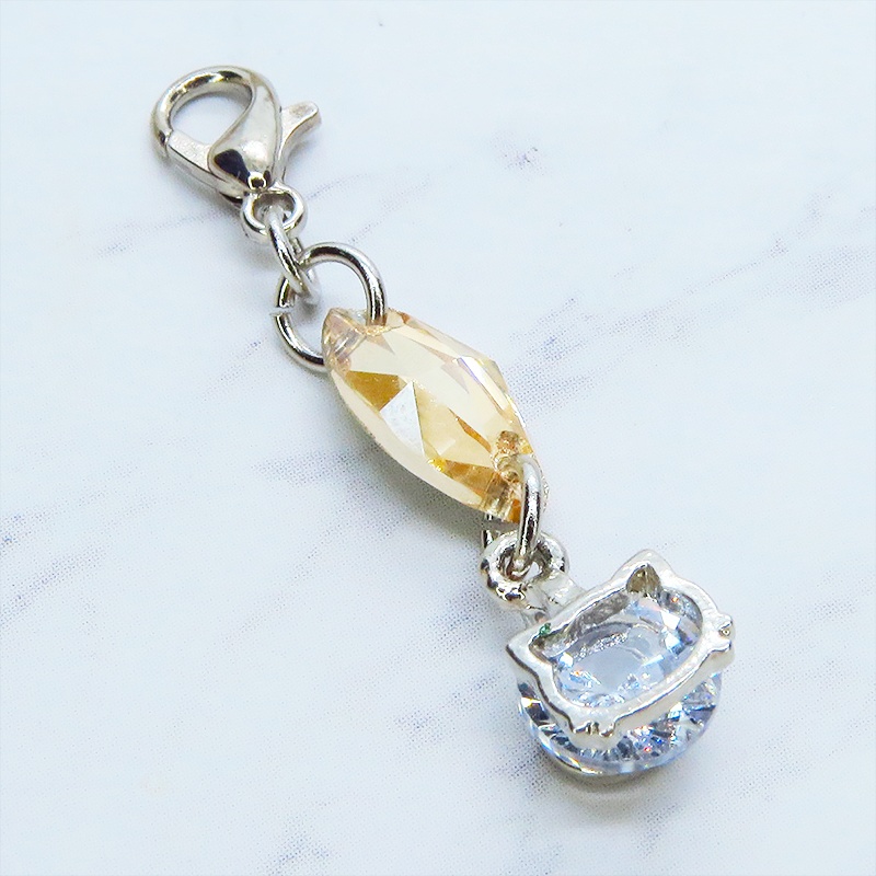 マスク・スマホチャーム シルバーカラー 猫フェイスクリスタルにスワロフスキー(ゴールドシャドー)をプラスしたチャーム 金具変更可