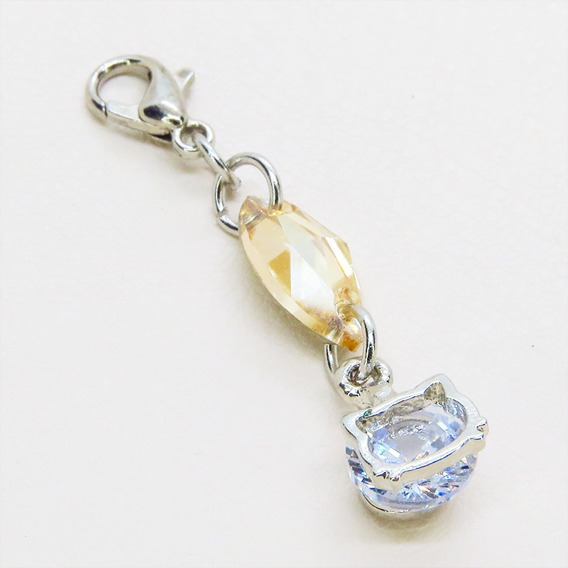 マスク・スマホチャーム シルバーカラー 猫フェイスクリスタルにスワロフスキー(ゴールドシャドー)をプラスしたチャーム 金具変更可