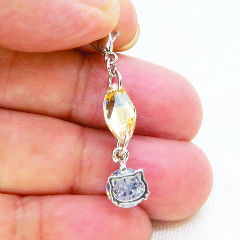 マスク・スマホチャーム シルバーカラー 猫フェイスクリスタルにスワロフスキー(ゴールドシャドー)をプラスしたチャーム 金具変更可