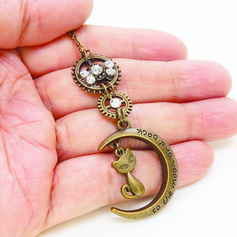 アンティークゴールド スチームパンク風の猫と三日月と歯車のペンダントネックレス ラインストーン 長さ調整可