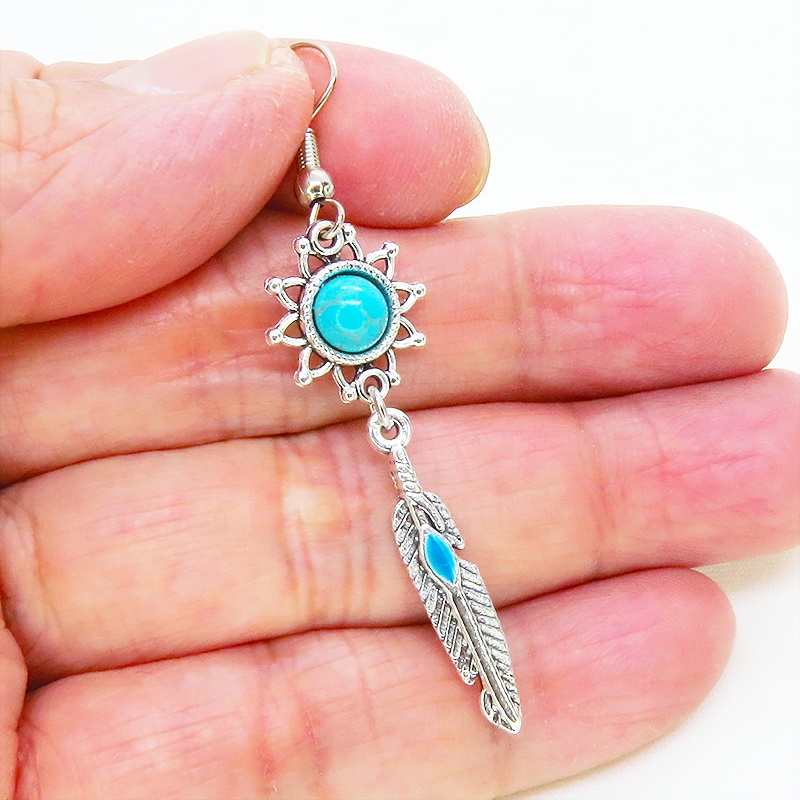 シルバーカラー フェザーとターコイズのひまわりを組合せたスリムなピアス サージカル可