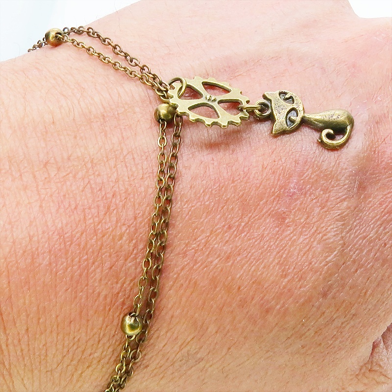 アンティークゴールド 猫と歯車モチーフのダブルチェーンブレスレット ビーズ付チェーン アジャスター可