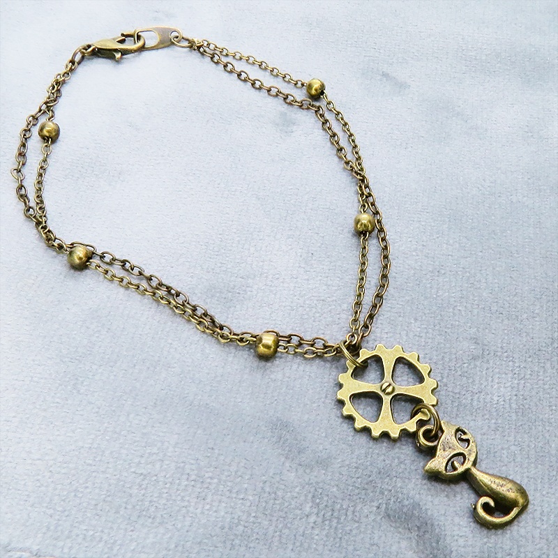 アンティークゴールド 猫と歯車モチーフのダブルチェーンブレスレット ビーズ付チェーン アジャスター可