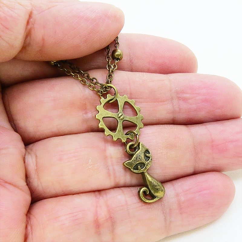 アンティークゴールド 猫と歯車モチーフのダブルチェーンブレスレット ビーズ付チェーン アジャスター可
