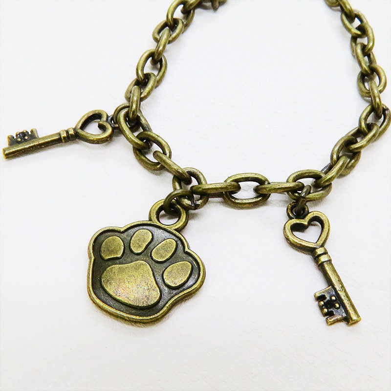 アンティークゴールド 大きめ肉球モチーフと鍵モチーフを組合せたブレスレット