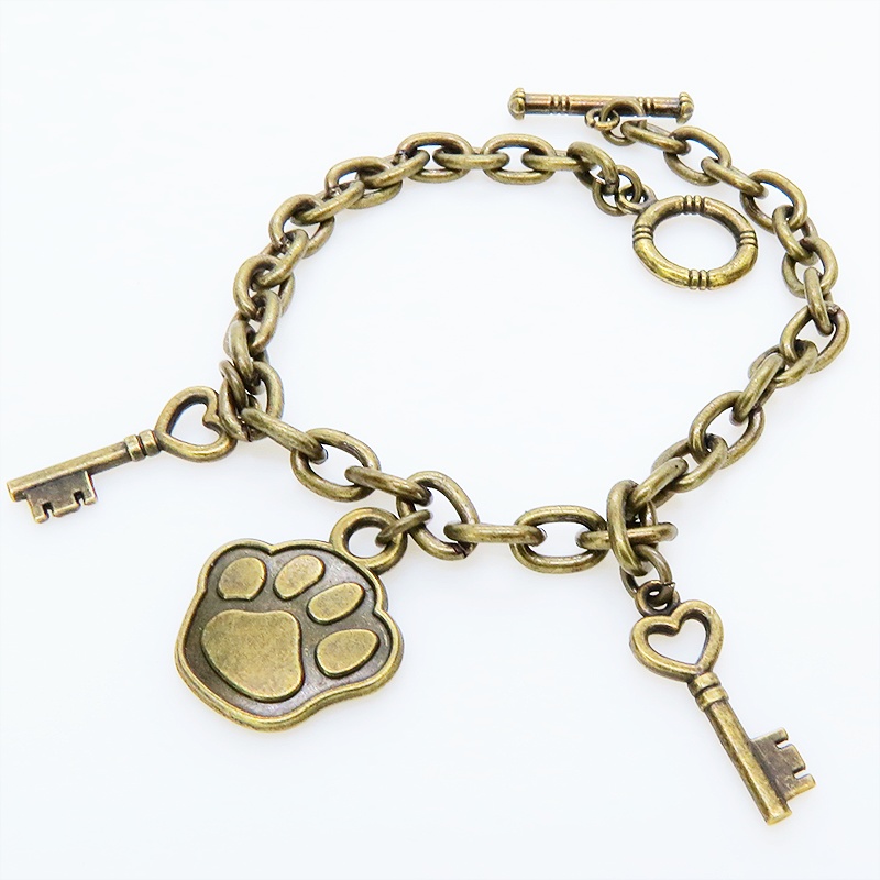 アンティークゴールド 大きめ肉球モチーフと鍵モチーフを組合せたブレスレット