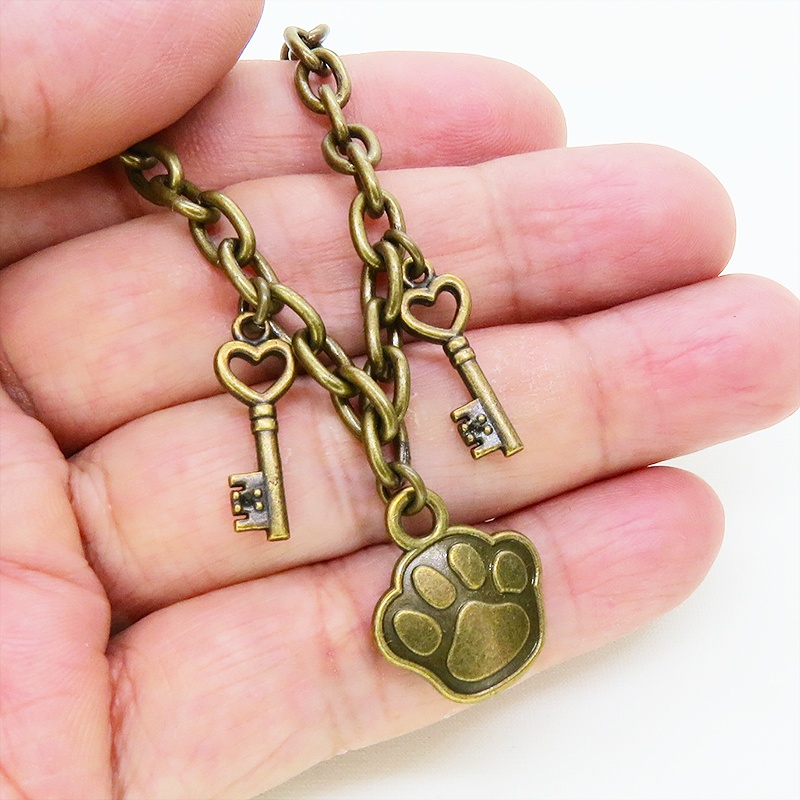 アンティークゴールド 大きめ肉球モチーフと鍵モチーフを組合せたブレスレット