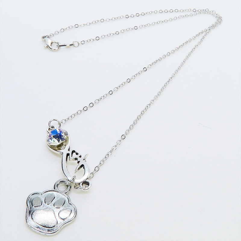シルバーカラー クリスタル(クリア)のエターニティーと肉球モチーフを組合せたネックレス ステンレス可 長さ調整可
