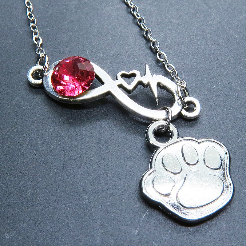 シルバーカラー クリスタル(マゼンタ)のエターニティーと肉球モチーフを組合せたネックレス ステンレス可 長さ調整可