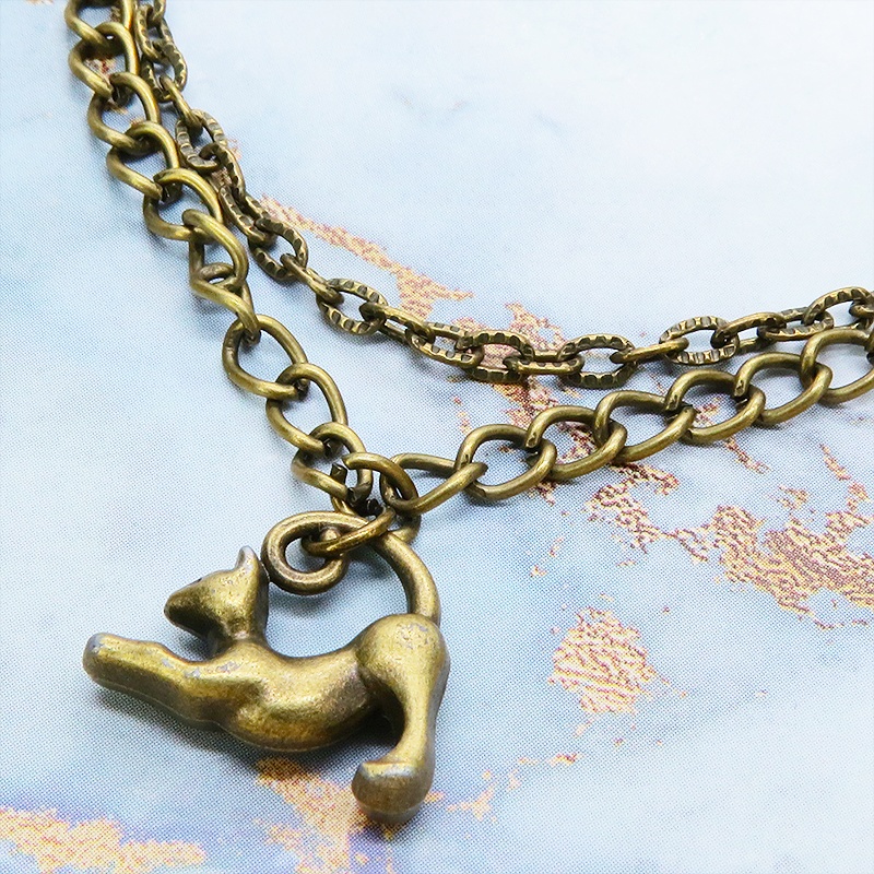 アンティークゴールド 伸び猫シルエットモチーフのダブルチェーンブレスレット