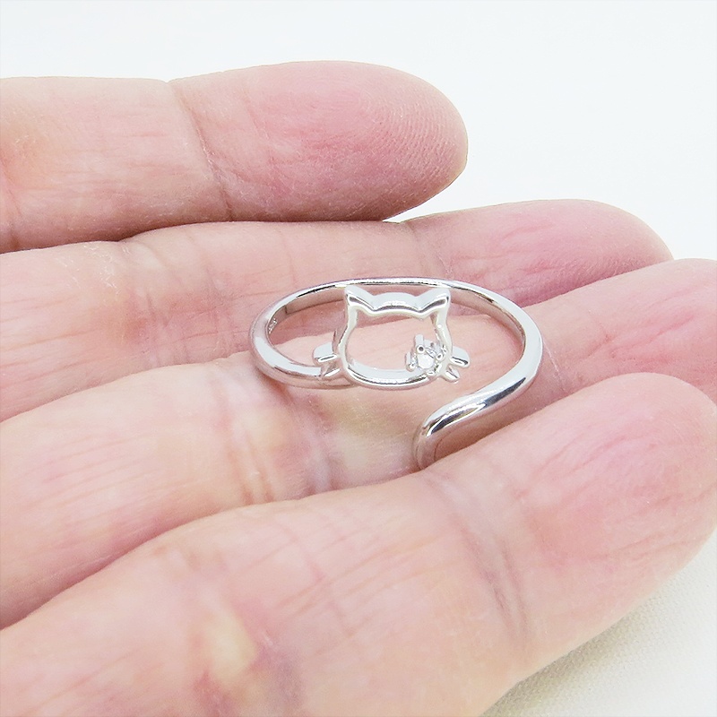 シルバー925 柔らかい曲線の猫シルエットモチーフのリング フリーサイズ キュービックジルコニア 尻尾