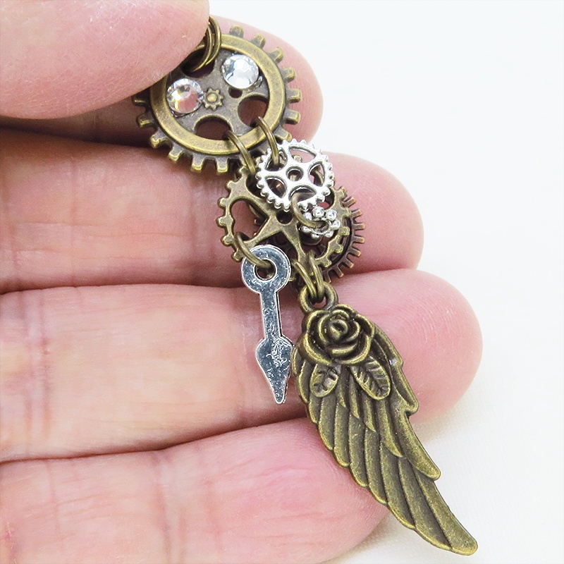 アンティークゴールド 翼と歯車を組合せた多層構造スチームパンクピアス ラインストーン