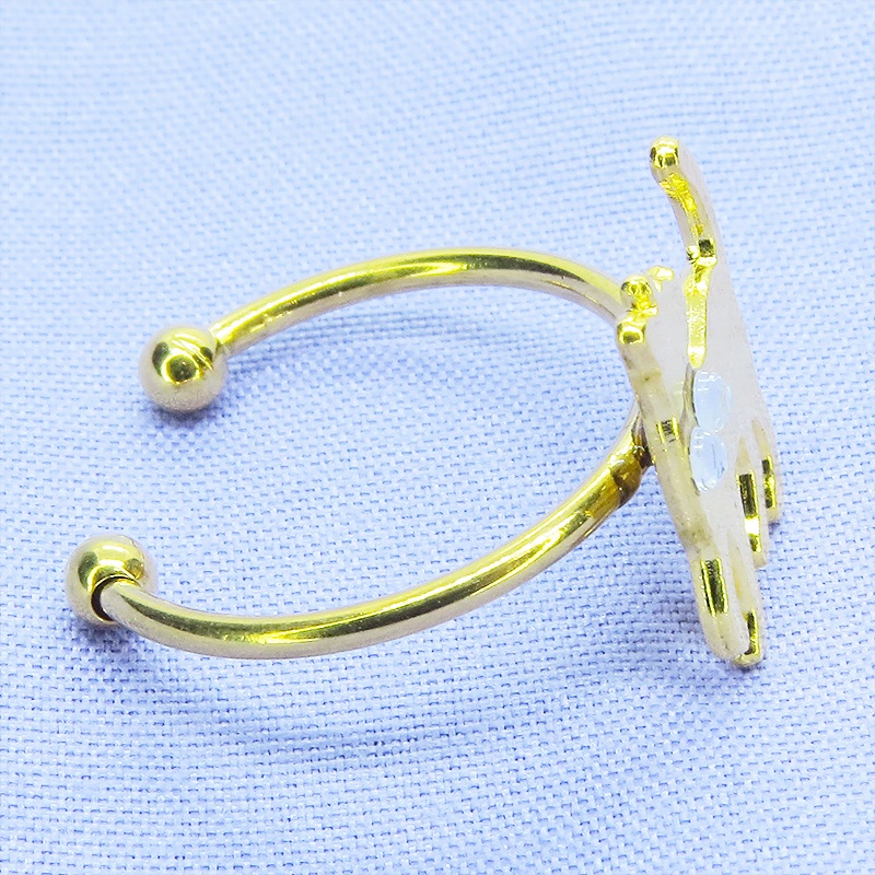 ゴールドカラー 振り向き猫シルエットモチーフのリング ラインストーン フリーサイズ