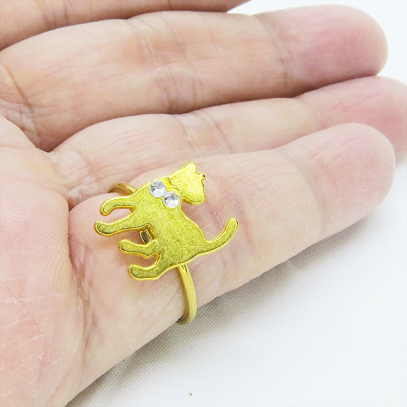 ゴールドカラー 振り向き猫シルエットモチーフのリング ラインストーン フリーサイズ