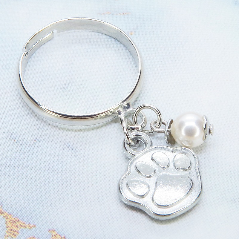 シルバーカラー 肉球とスワロフスキーパールの大人可愛いリング フリーサイズ クリスタルホワイト