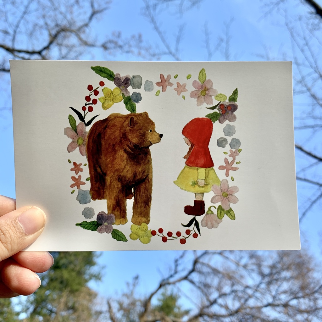クマとニンゲンの女の子のポストカード