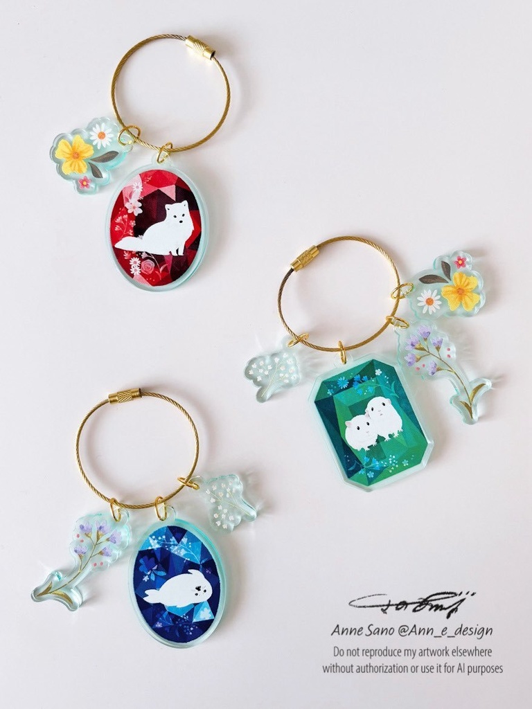 宝石と白い動物たちのアクリルキーホルダー