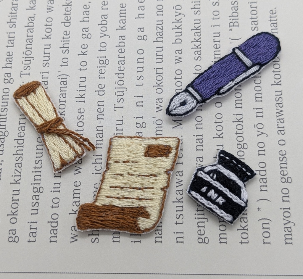 契約時の刺しゅうブローチ