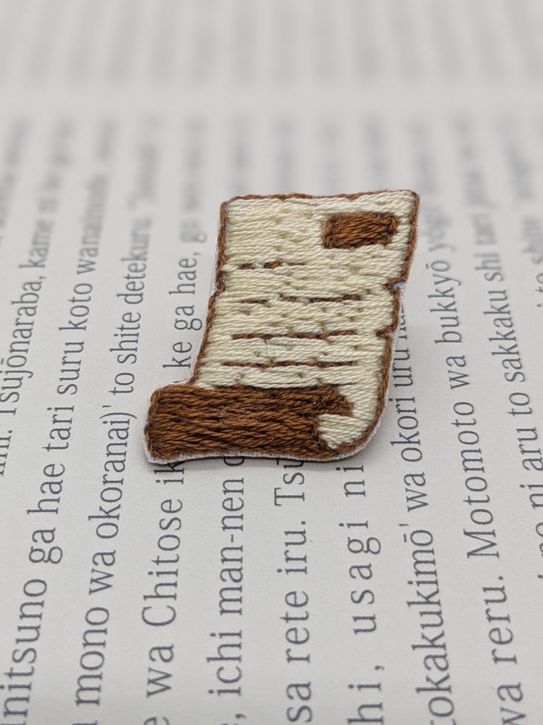 契約時の刺しゅうブローチ