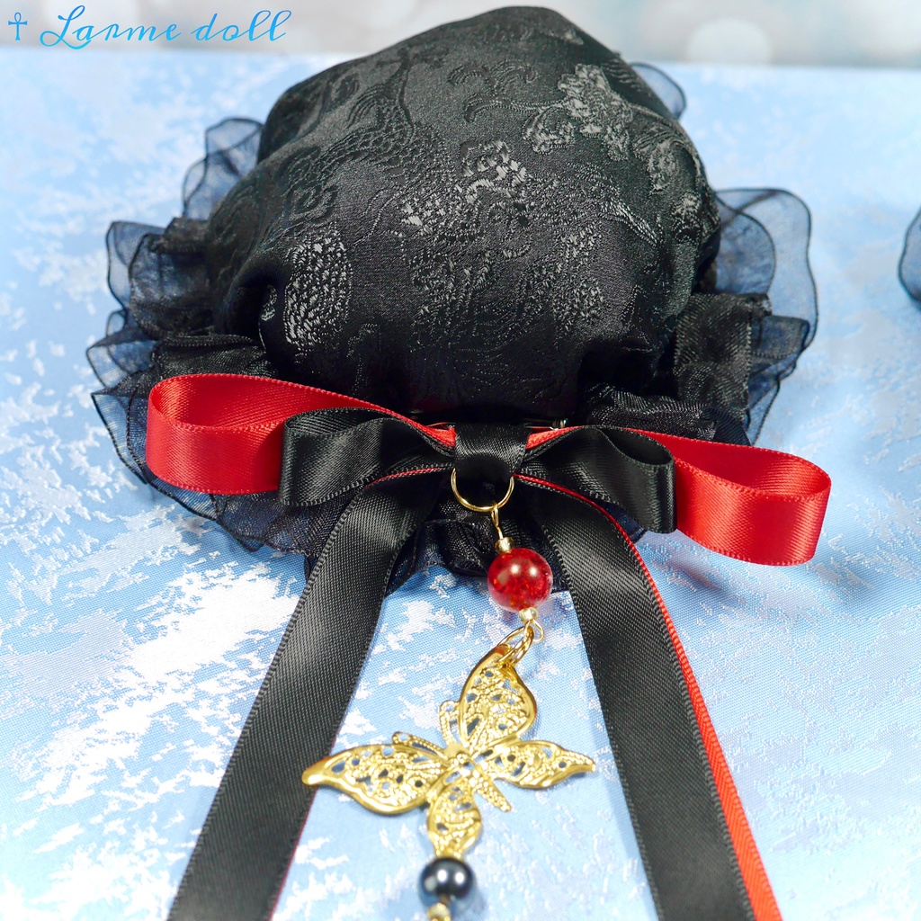 【受注生産】《☥》ダブルリボンタッセル付きお団子カバー カラー▷黒×赤 (接合パーツ、蝶チャームゴールドカラーVer.)