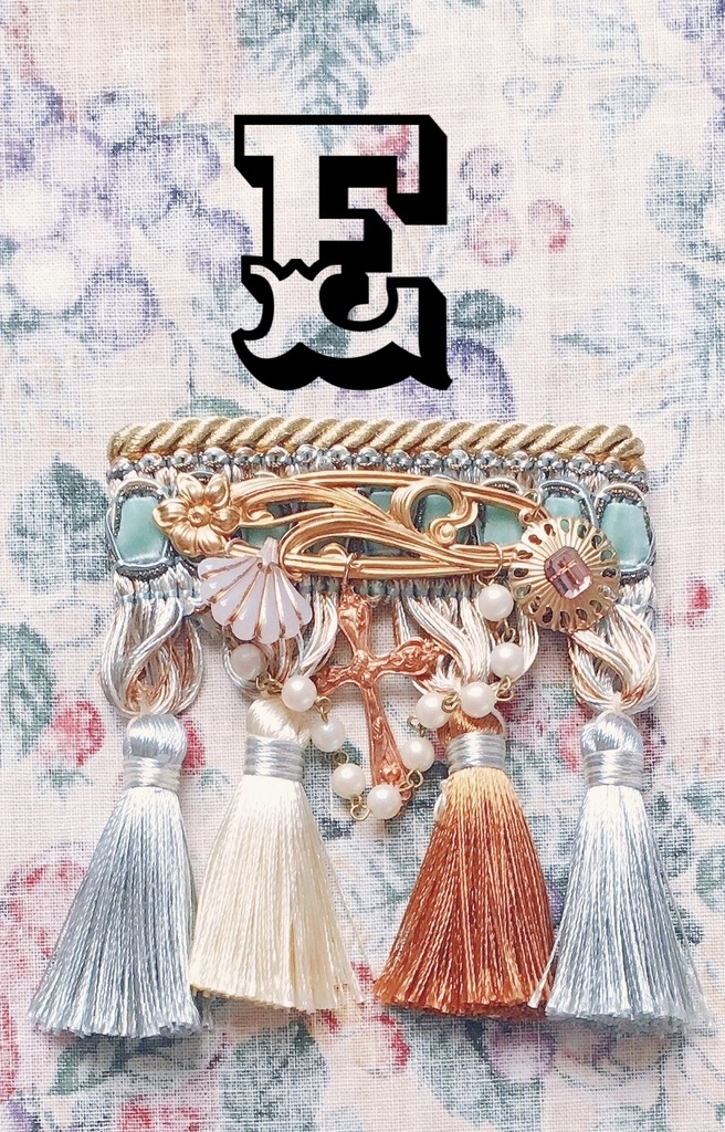 tassel brooch