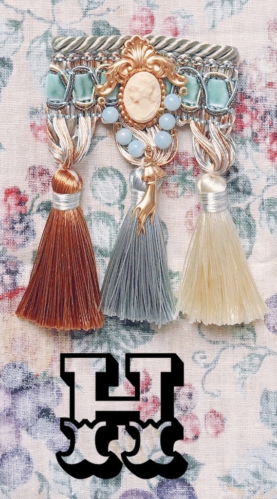 tassel brooch