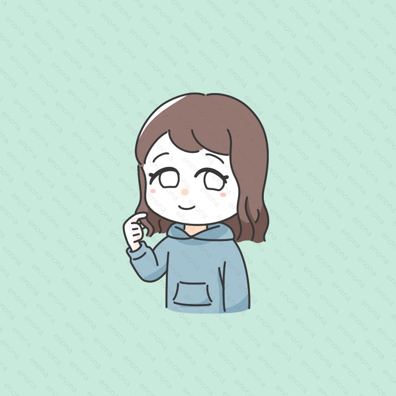 毛先を軽くつまんだ女の子