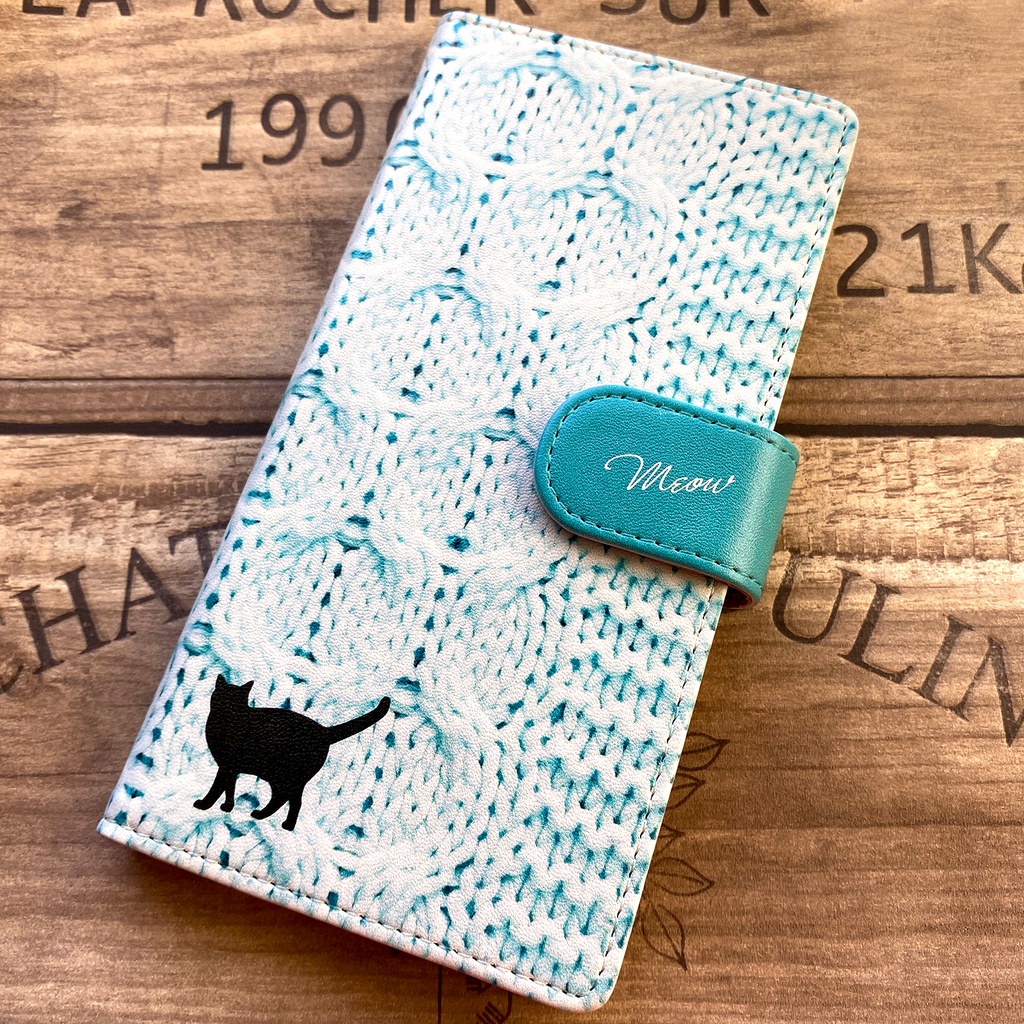 にゃんこニットの手帳型スマホケース(アイスブルー) 全機種対応 手帳型 スマホケース iphone15 iphone16e 猫 黒猫 iphone14