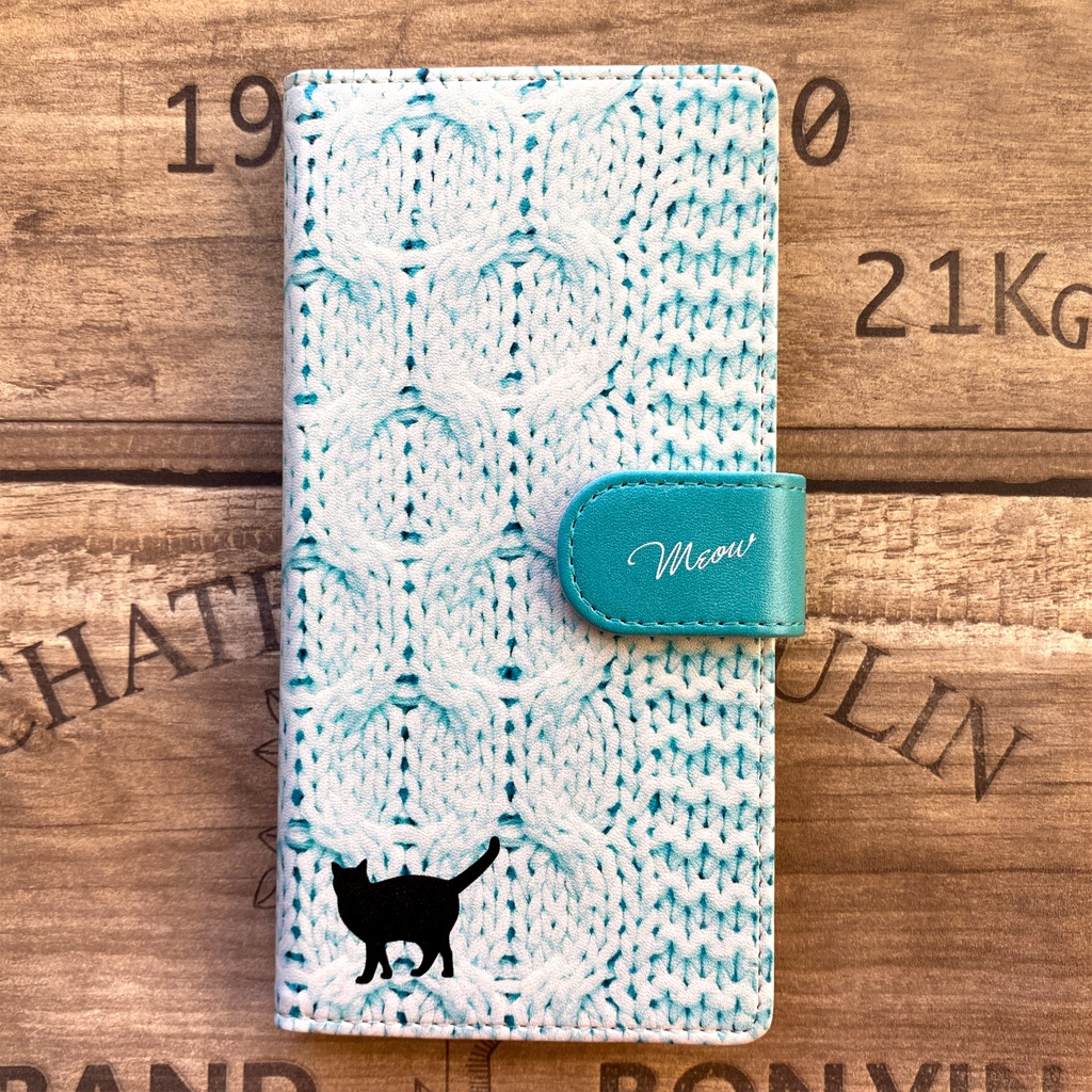 にゃんこニットの手帳型スマホケース(アイスブルー) 全機種対応 手帳型 スマホケース iphone15 iphone16e 猫 黒猫 iphone14