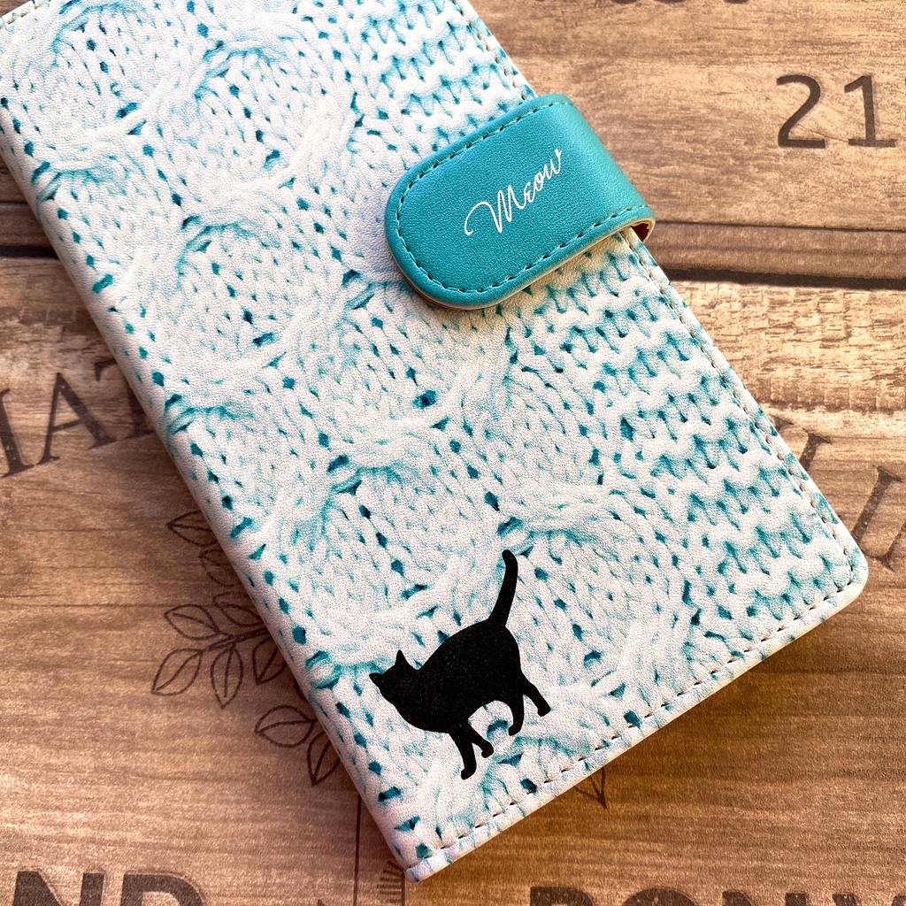 にゃんこニットの手帳型スマホケース(アイスブルー) 全機種対応 手帳型 スマホケース iphone15 iphone16e 猫 黒猫 iphone14