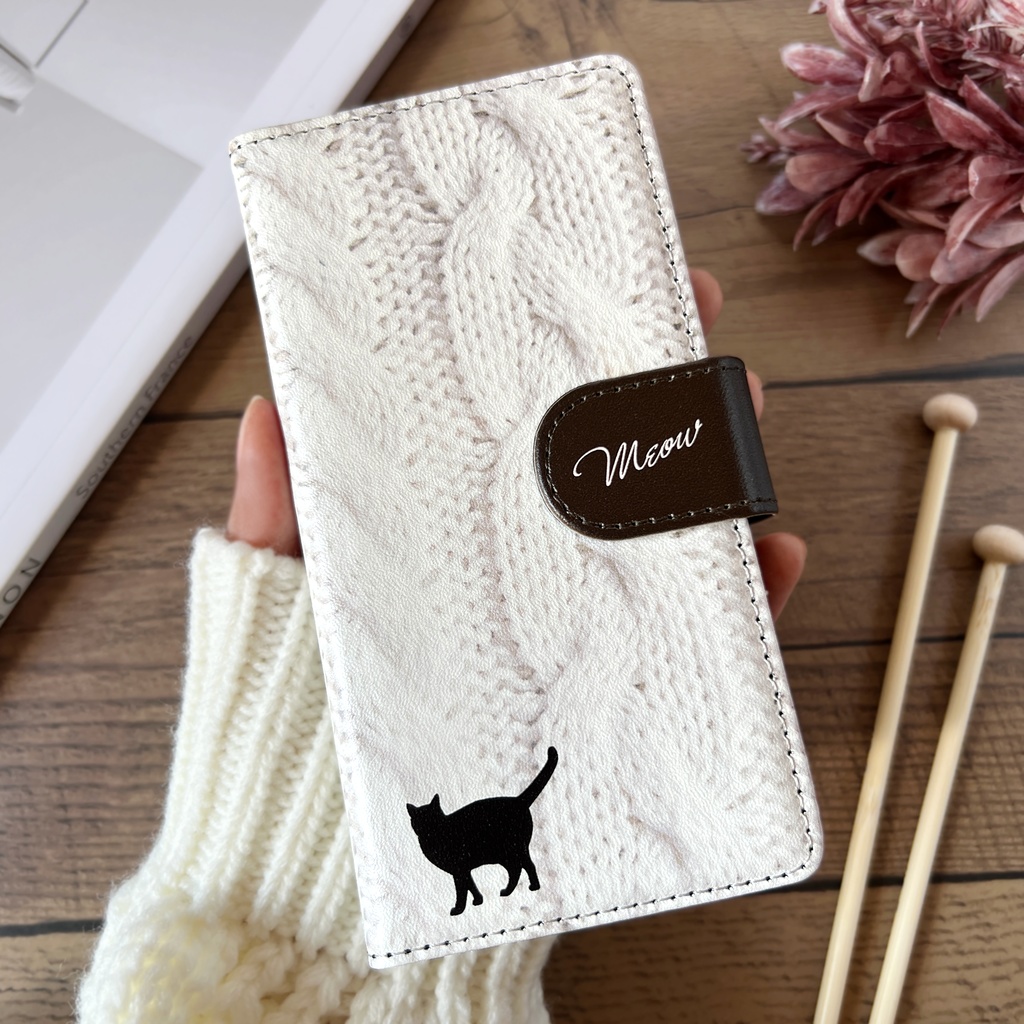 にゃんこアランニットの手帳型スマホケース（ホワイト×ブラウン） 全機種対応 手帳型 スマホケース iphone15 iphone16e iphone14 iPhone17 Air 猫 黒猫