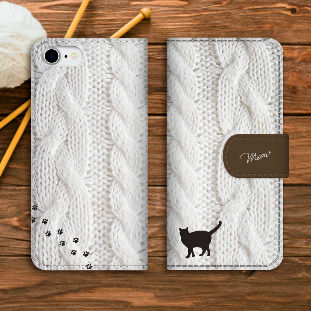 にゃんこアランニットの手帳型スマホケース(ホワイト×ブラウン) 全機種対応 手帳型 スマホケース iphone15 iphone16e iphone14 iPhone17 Air 猫 黒猫