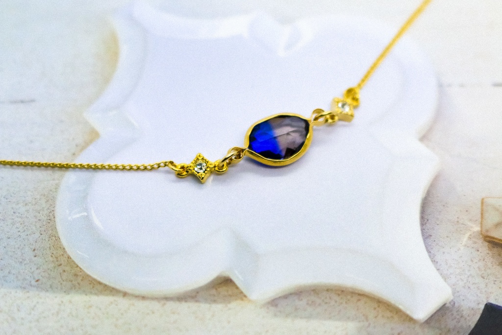 グラデーションクリスタルガラスのブレスレット ブルー×ブラウン 変形カットゴールド金具