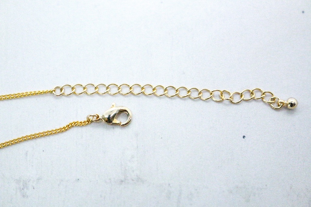 グラデーションクリスタルガラスのブレスレット エメラルド×クリア 変形カットゴールド金具