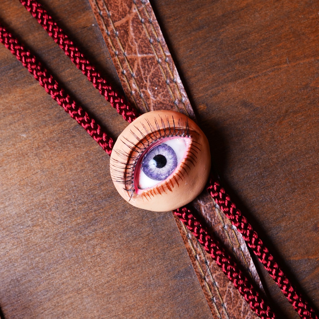 瞳ループタイ（紫×赤）