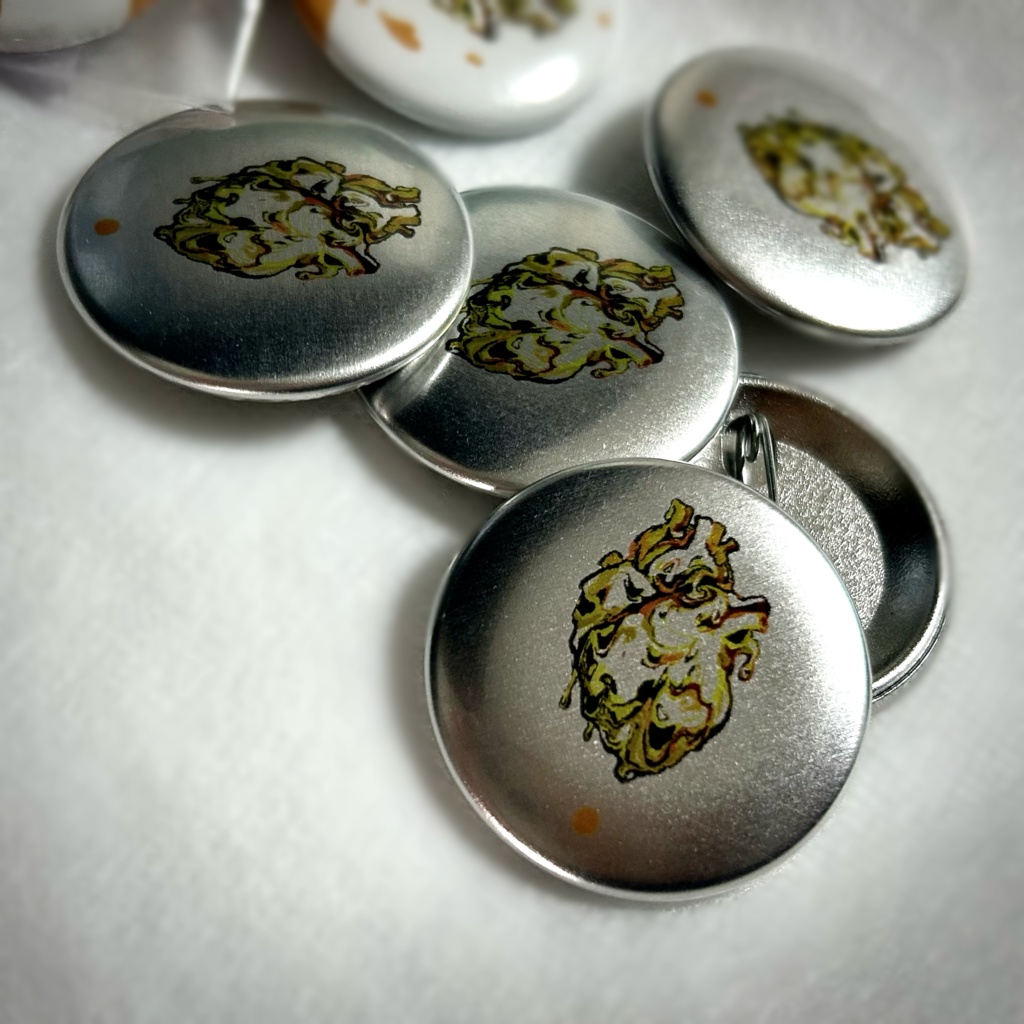 『オレンジジュースの心臓』メタリック缶バッジ