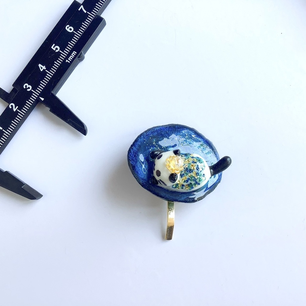 宇宙を泳ぐ猫のポニーフック