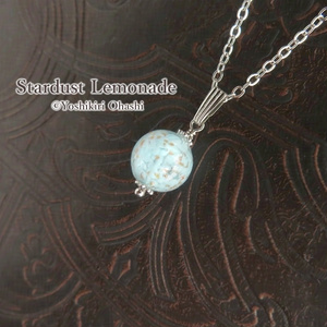 A Venetian glass pendant with the shimmering effect of water droplets.