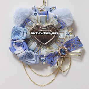 Rosette with rose and cat ears (light blue), without a dangling ribbon.