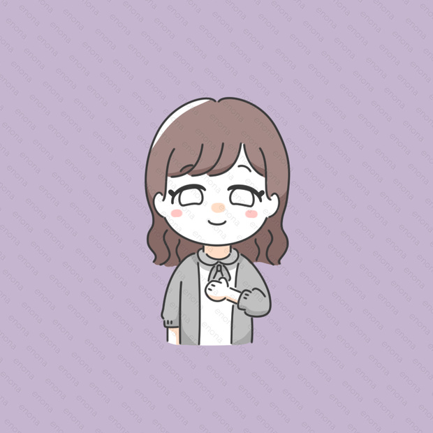 胸の前で拳を握る女の子