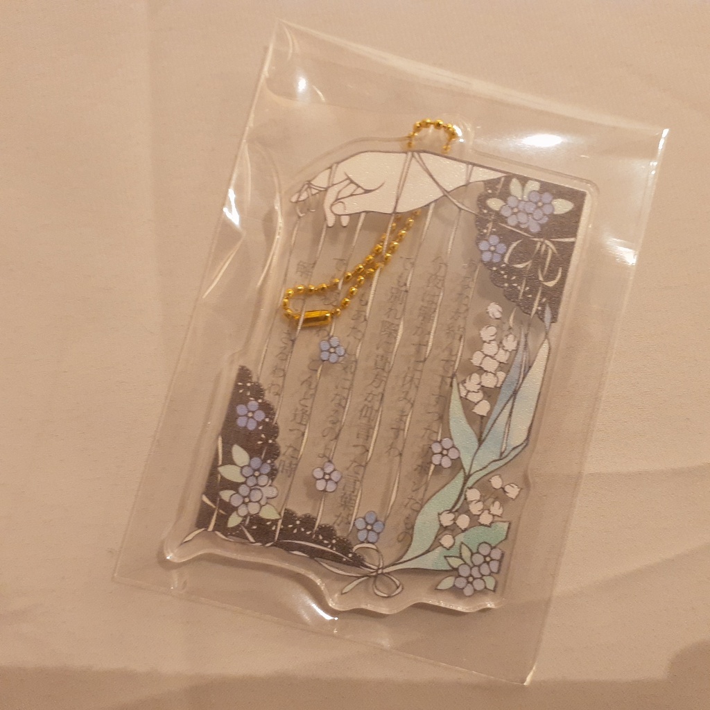 アクリルキーホルダー「リボンのまじない」