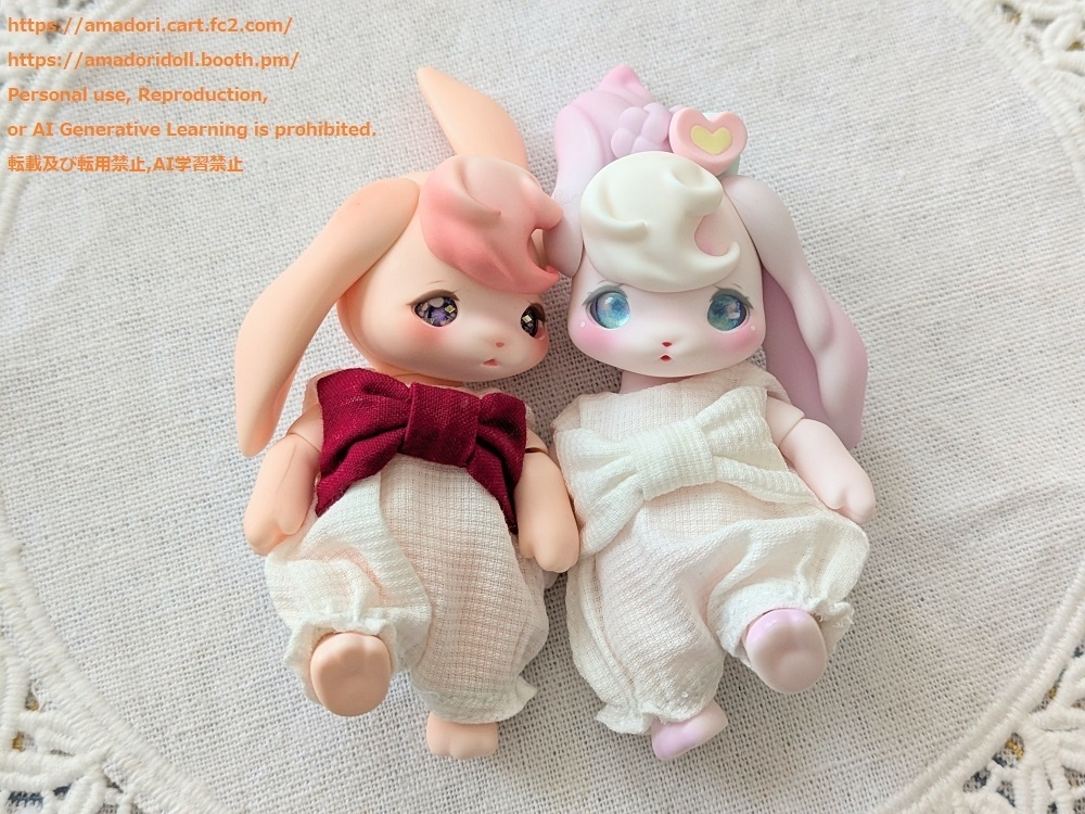 大きなリボンのロンパース