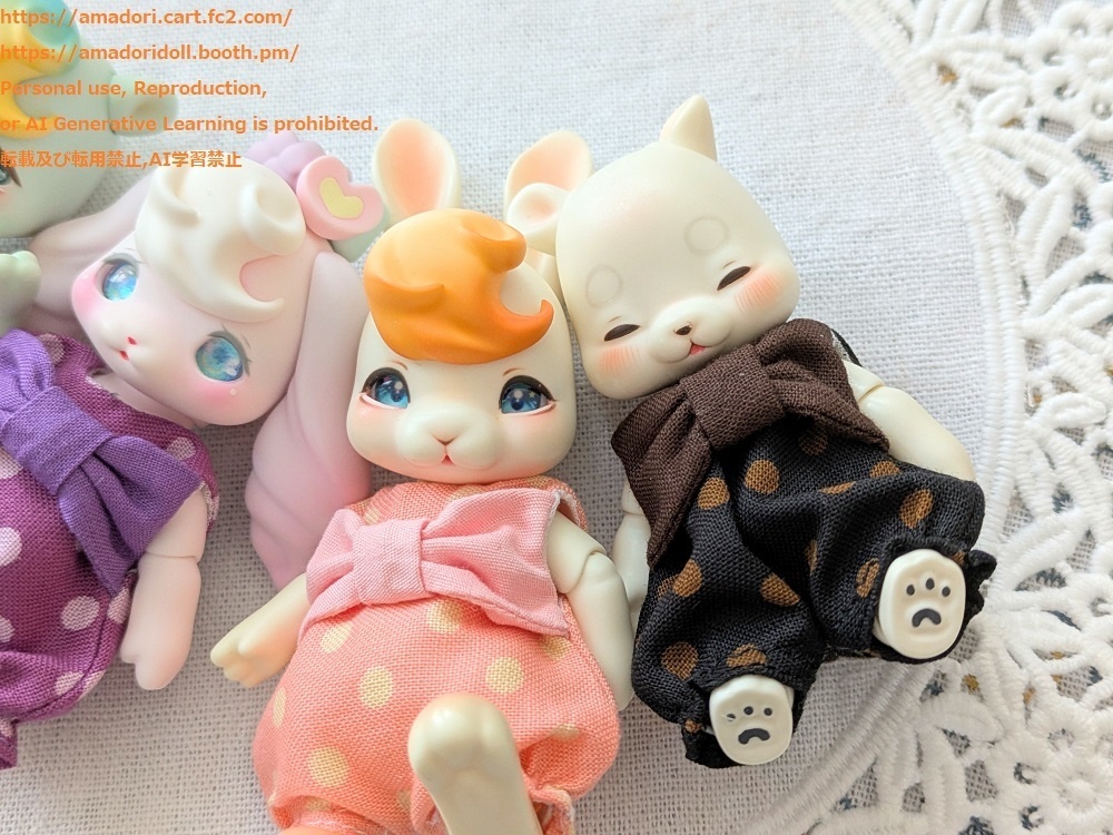 大きなリボンのロンパース